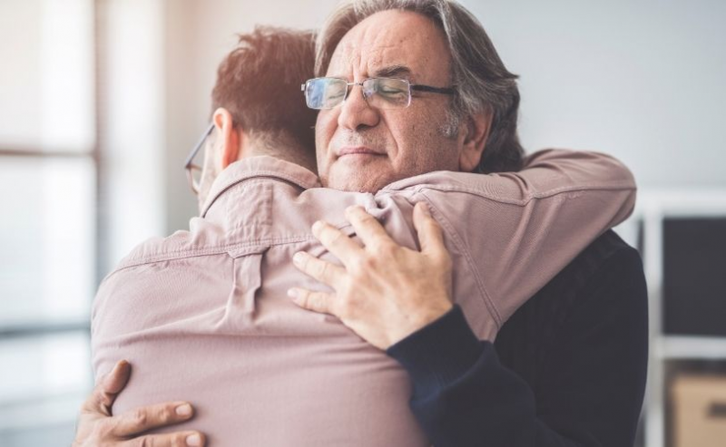 Father and son hugging